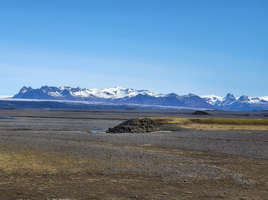 Snow peaked mountains off in the distance